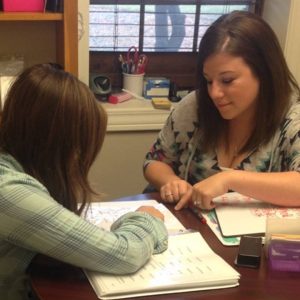 Lisa Mietz reading with a student